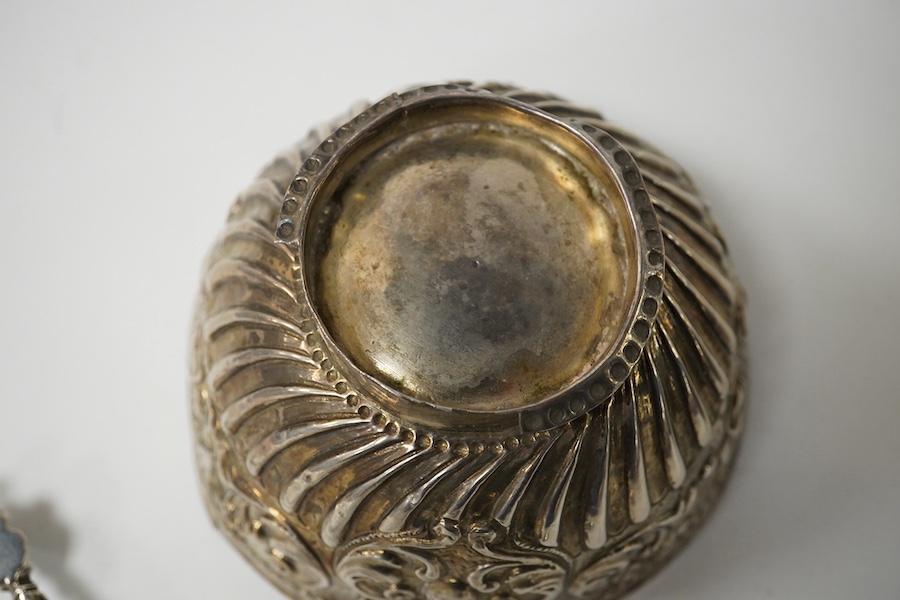 A small French white metal hot water pot, 13cm, a continental white metal bowl (a.f.) and a 19th century German white metal spoon. Condition - poor to fair